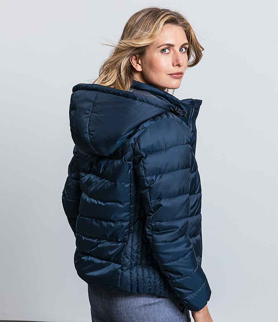 Russell Ladies Hooded Nano Padded Jacket in by Russell — Custom branded clothing by Print Press, featuring premium embroidery produced in our specialist print lab in the UK.
