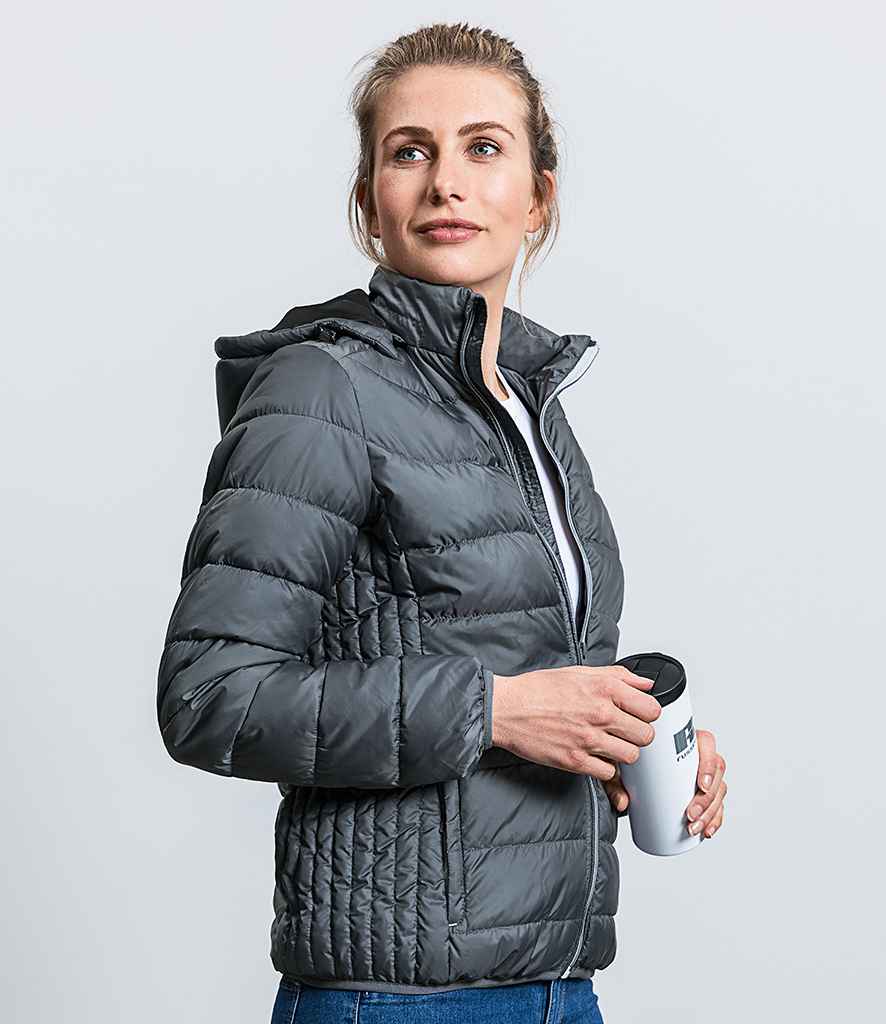 Russell Ladies Hooded Nano Padded Jacket in by Russell — Custom branded clothing by Print Press, featuring premium embroidery produced in our specialist print lab in the UK.