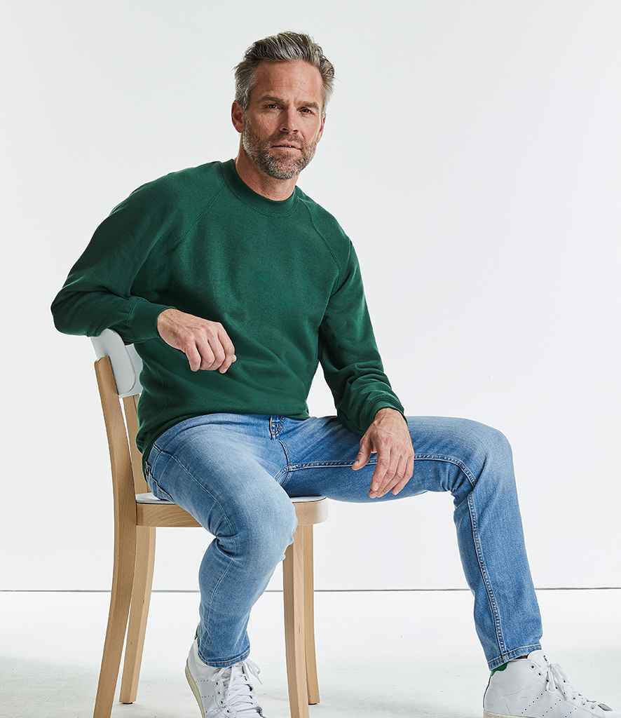 Russell Raglan Sweatshirt in by Russell — Custom branded clothing by Print Press, featuring premium embroidery produced in our specialist print lab in the UK.