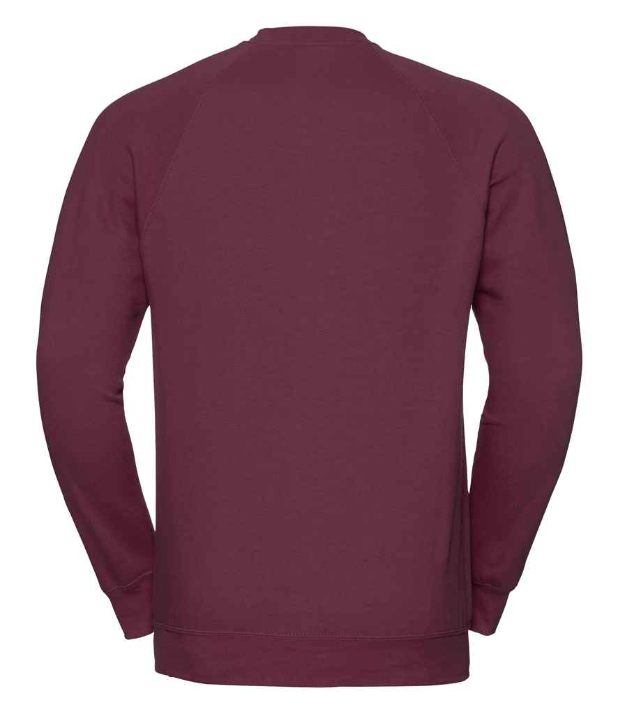 Russell Raglan Sweatshirt in by Russell — Custom branded clothing by Print Press, featuring premium embroidery produced in our specialist print lab in the UK.