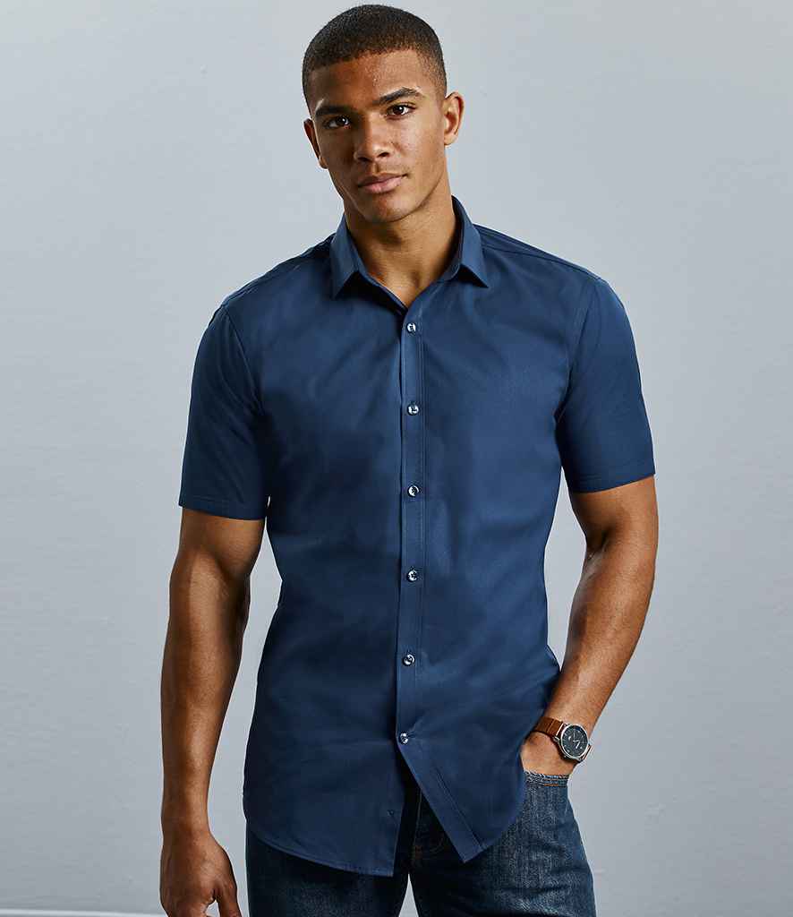 Russell Collection Ultimate Short Sleeve Stretch Shirt in Bright Navy by Russell — Custom branded clothing by Print Press, featuring premium embroidery produced in our specialist print lab in the UK.