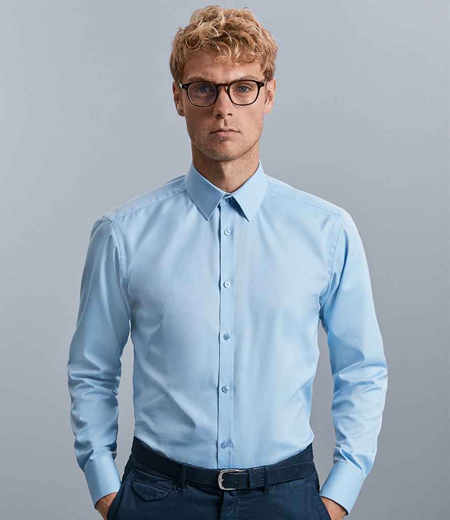 Russell Collection Long Sleeve Herringbone Shirt in Light Blue by Russell — Custom branded clothing by Print Press, featuring premium embroidery produced in our specialist print lab in the UK.