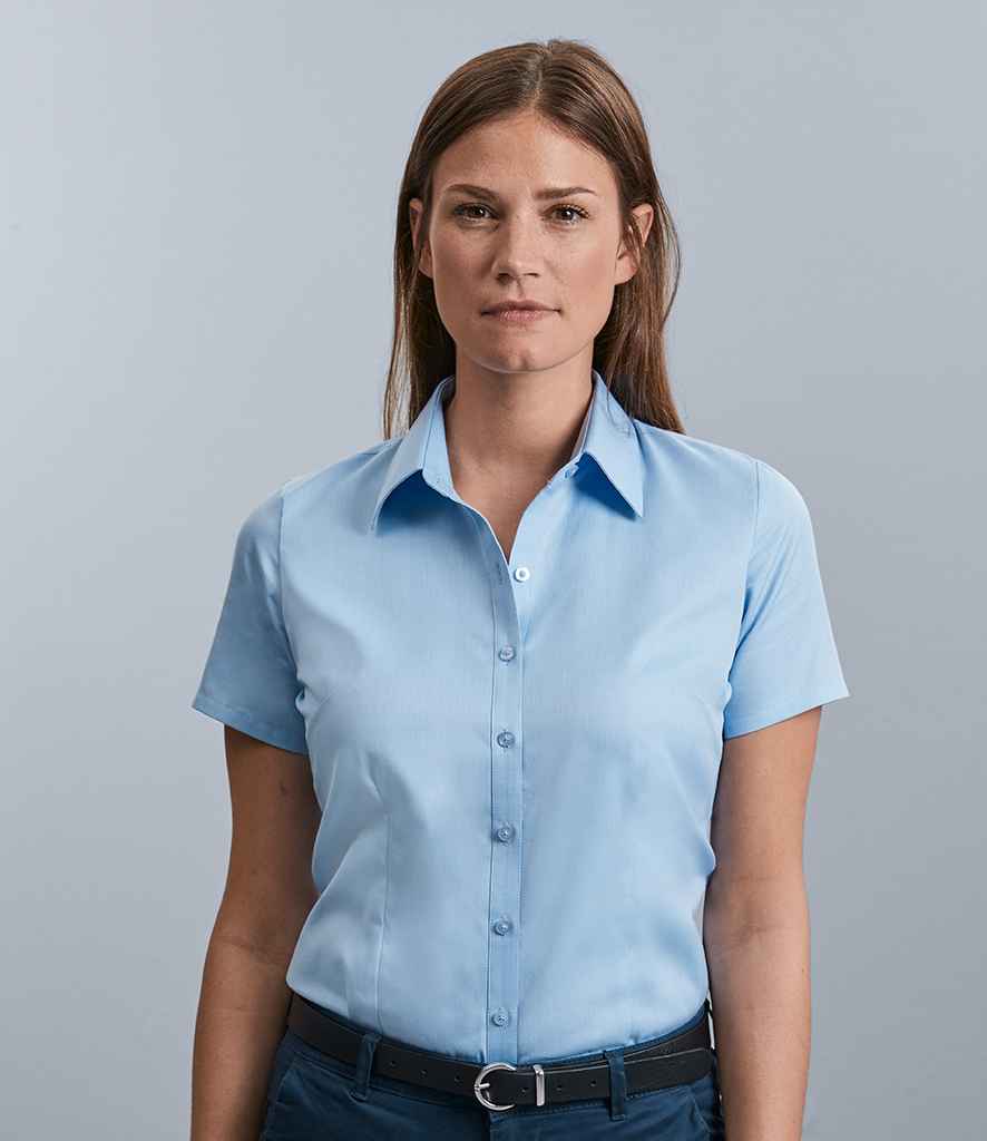 Russell Collection Ladies Short Sleeve Herringbone Shirt in Light Blue by Russell — Custom branded clothing by Print Press, featuring premium embroidery produced in our specialist print lab in the UK.