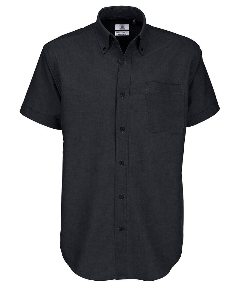 B&C Oxford Short Sleeve Men's in Black by B & C Collection — Custom branded clothing by Print Press, featuring premium embroidery produced in our specialist print lab in the UK.
