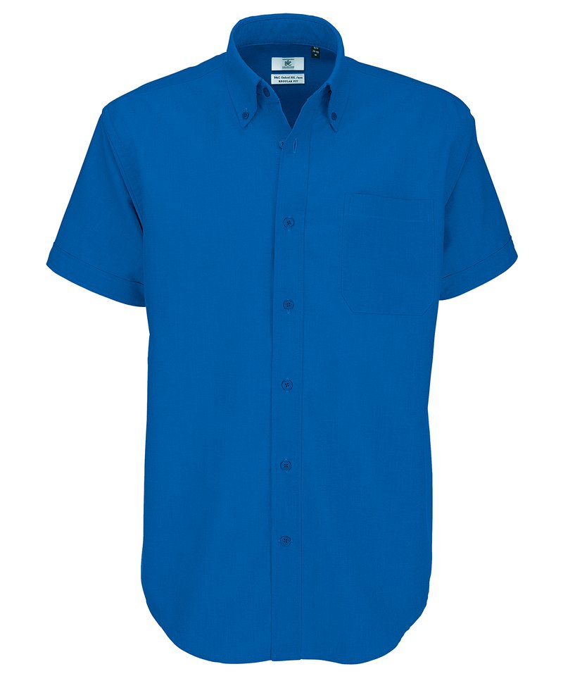 B&C Oxford Short Sleeve Men's in Blue Chip by B & C Collection — Custom branded clothing by Print Press, featuring premium embroidery produced in our specialist print lab in the UK.