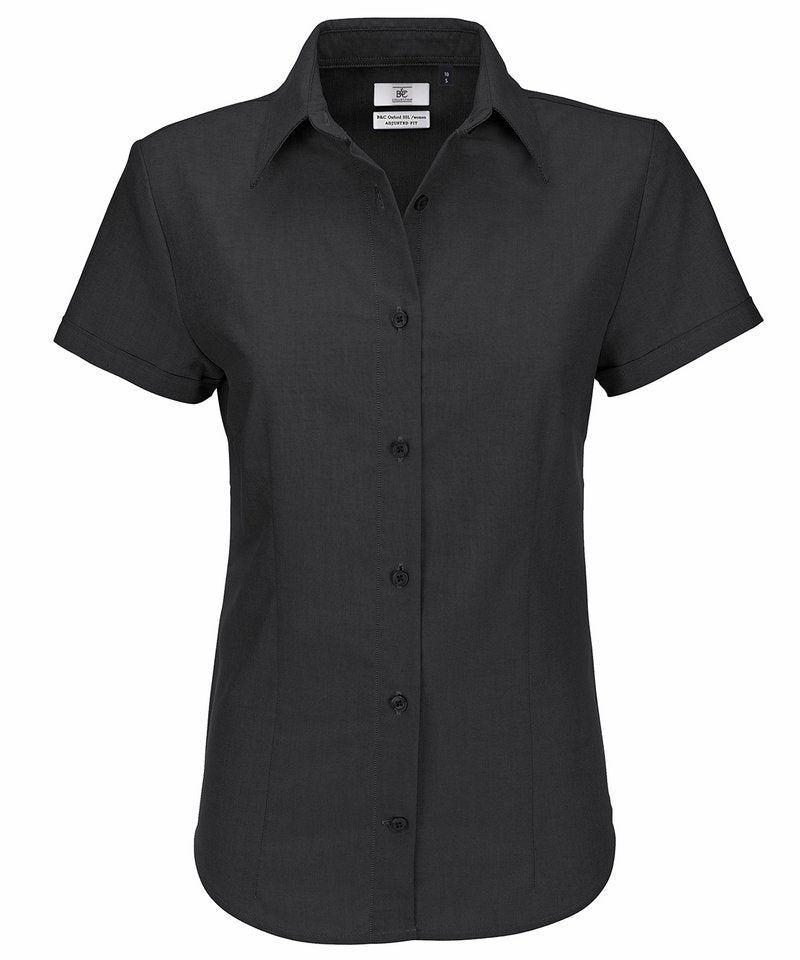 B&C Oxford Short Sleeve Women's in Black by B & C Collection — Custom branded clothing by Print Press, featuring premium embroidery produced in our specialist print lab in the UK.