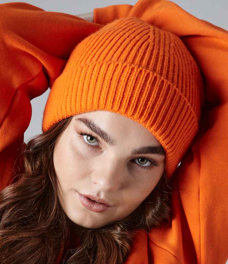 Beechfield Engineered Knit Ribbed Beanie in ONE Orange by Beechfield — Custom branded clothing by Print Press, featuring premium embroidery produced in our specialist print lab in the UK.