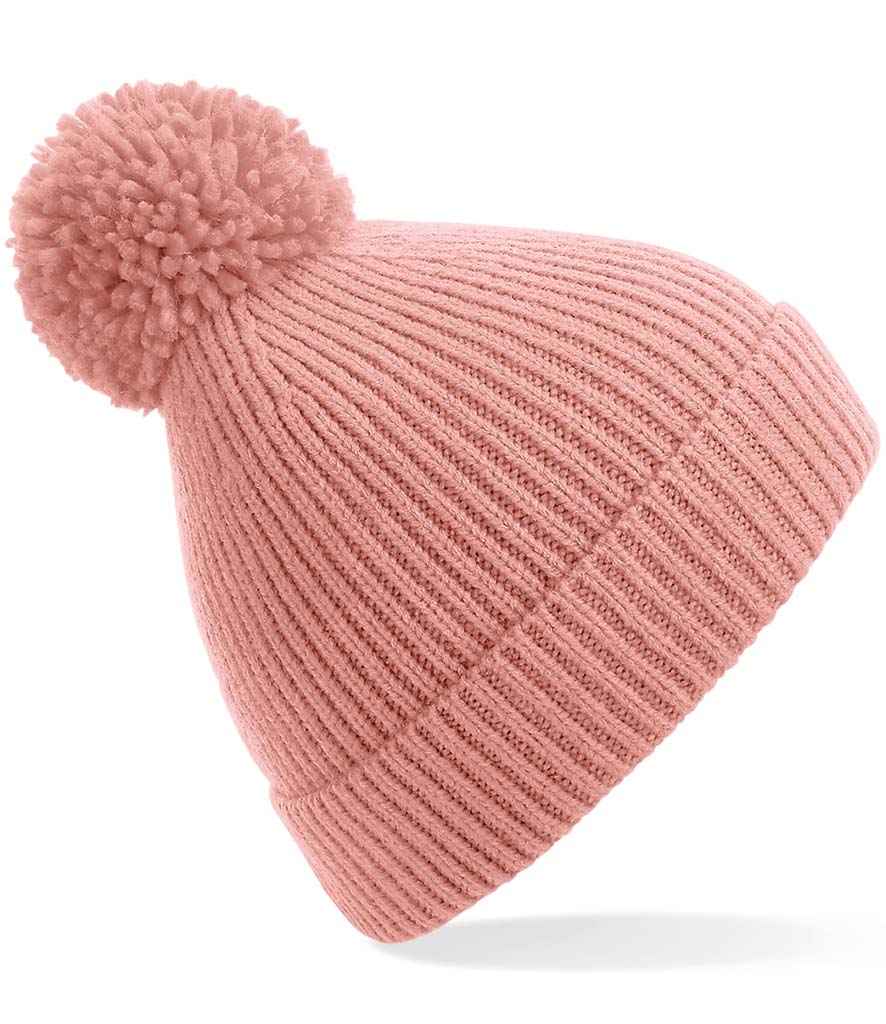 Beechfield Engineered Knit Ribbed Pom Pom Beanie in ONE Blush by Beechfield — Custom branded clothing by Print Press, featuring premium embroidery produced in our specialist print lab in the UK.