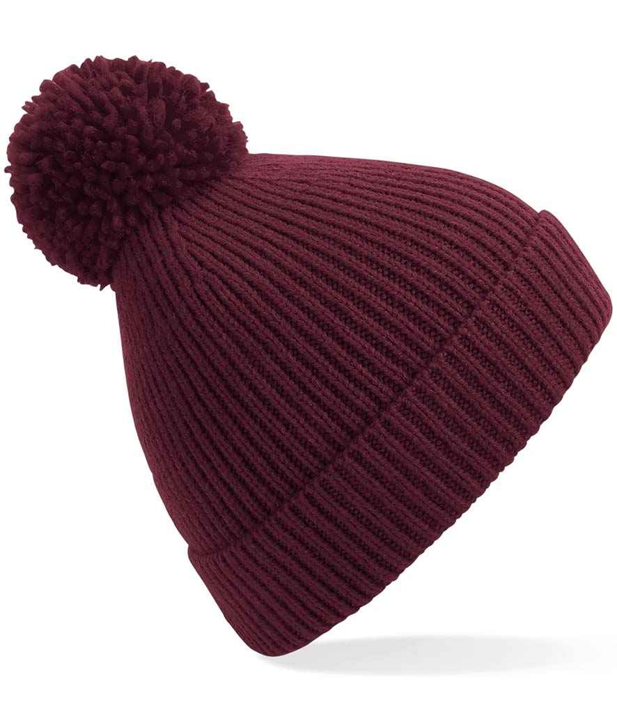 Beechfield Engineered Knit Ribbed Pom Pom Beanie in ONE Burgundy by Beechfield — Custom branded clothing by Print Press, featuring premium embroidery produced in our specialist print lab in the UK.