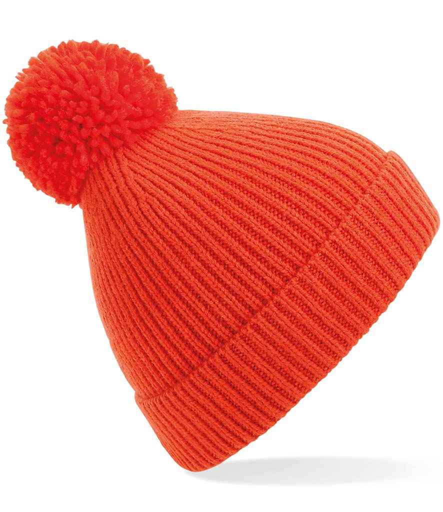 Beechfield Engineered Knit Ribbed Pom Pom Beanie in ONE Fire Red by Beechfield — Custom branded clothing by Print Press, featuring premium embroidery produced in our specialist print lab in the UK.