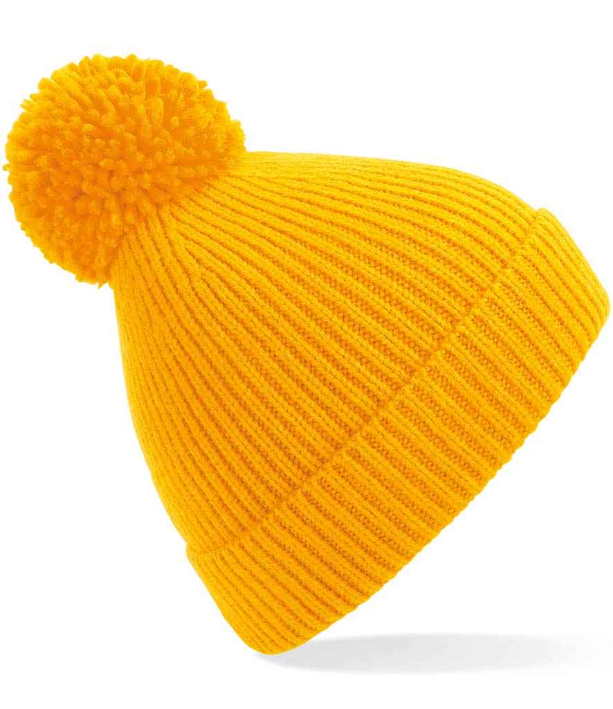 Beechfield Engineered Knit Ribbed Pom Pom Beanie in ONE Sun Yellow by Beechfield — Custom branded clothing by Print Press, featuring premium embroidery produced in our specialist print lab in the UK.