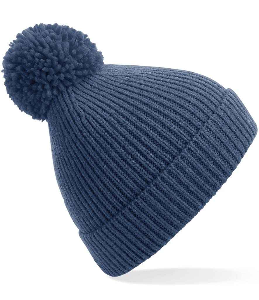 Beechfield Engineered Knit Ribbed Pom Pom Beanie in ONE Steel Blue by Beechfield — Custom branded clothing by Print Press, featuring premium embroidery produced in our specialist print lab in the UK.