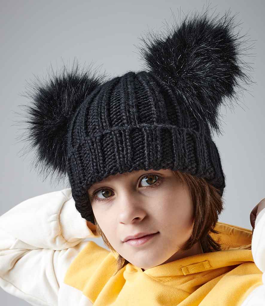 Beechfield Junior Faux Fur Double Pom Pom Beanie in ONE Black by Beechfield — Custom branded clothing by Print Press, featuring premium embroidery produced in our specialist print lab in the UK.