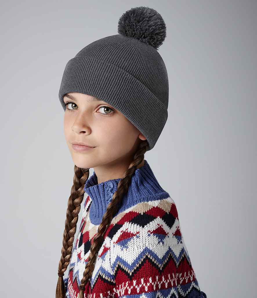 Beechfield Kids Original Pom Pom Beanie in ONE Graphite Grey by Beechfield — Custom branded clothing by Print Press, featuring premium embroidery produced in our specialist print lab in the UK.