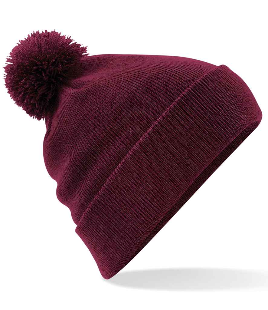 Beechfield Original Pom Pom Beanie in ONE Burgundy by Beechfield — Custom branded clothing by Print Press, featuring premium embroidery produced in our specialist print lab in the UK.