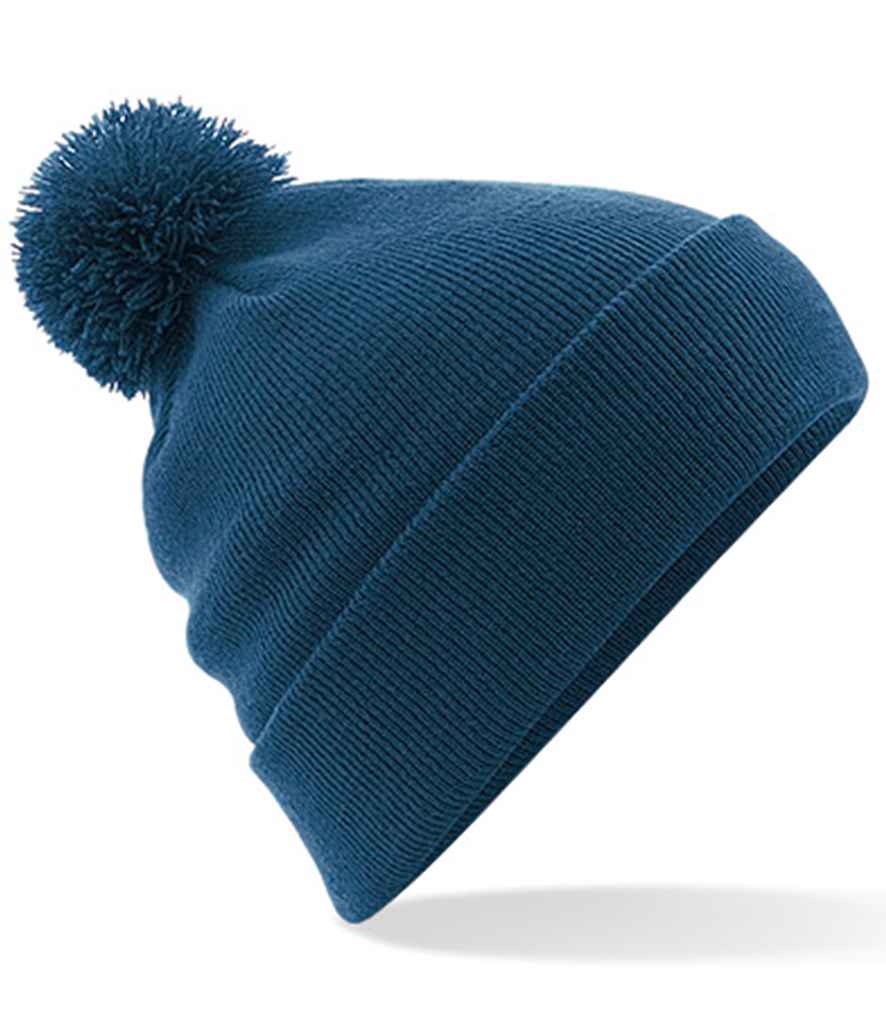 Beechfield Original Pom Pom Beanie in ONE Petrol by Beechfield — Custom branded clothing by Print Press, featuring premium embroidery produced in our specialist print lab in the UK.