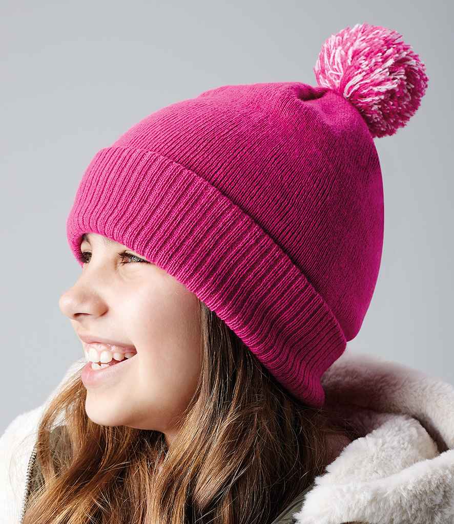 Beechfield Kids Snowstar® Beanie in ONE Fuchsia Off White by Beechfield — Custom branded clothing by Print Press, featuring premium embroidery produced in our specialist print lab in the UK.