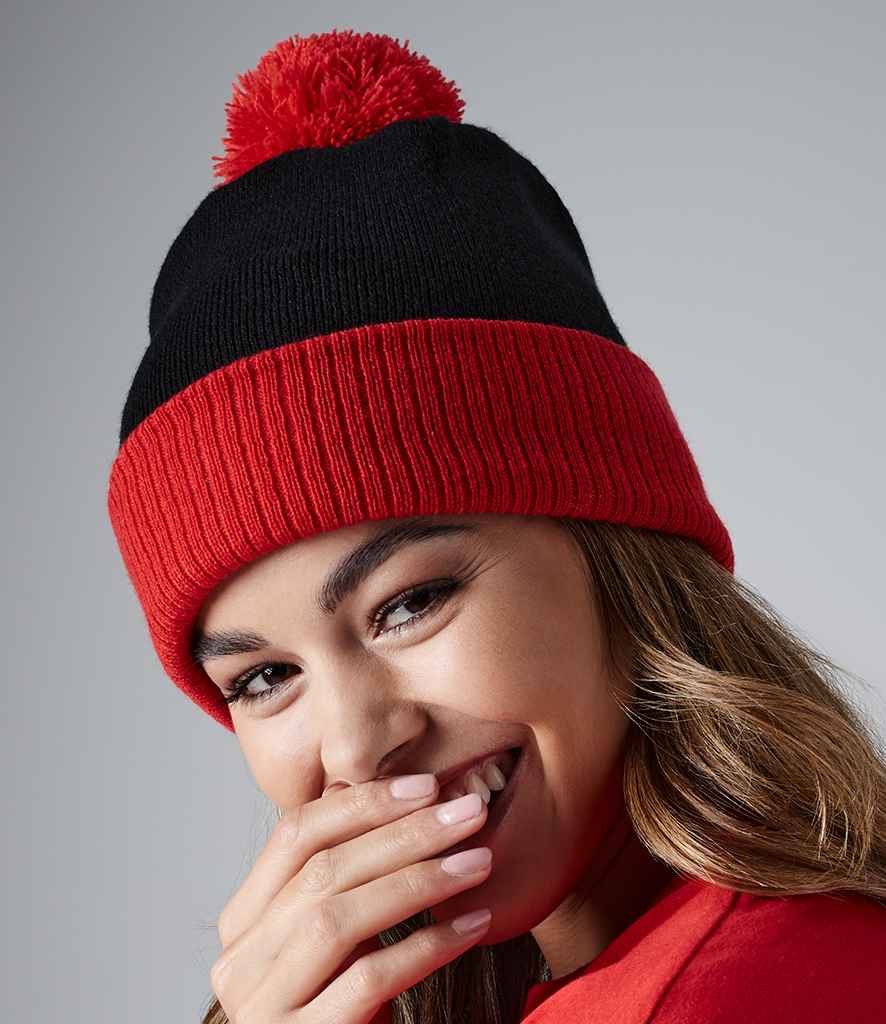 Beechfield Snowstar® Two Tone Beanie in ONE Black Bright Red by Beechfield — Custom branded clothing by Print Press, featuring premium embroidery produced in our specialist print lab in the UK.