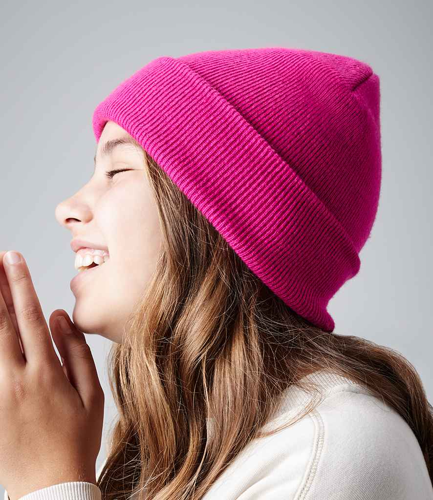 Beechfield Kids Original Cuffed Beanie in ONE Fuchsia by Beechfield — Custom branded clothing by Print Press, featuring premium embroidery produced in our specialist print lab in the UK.
