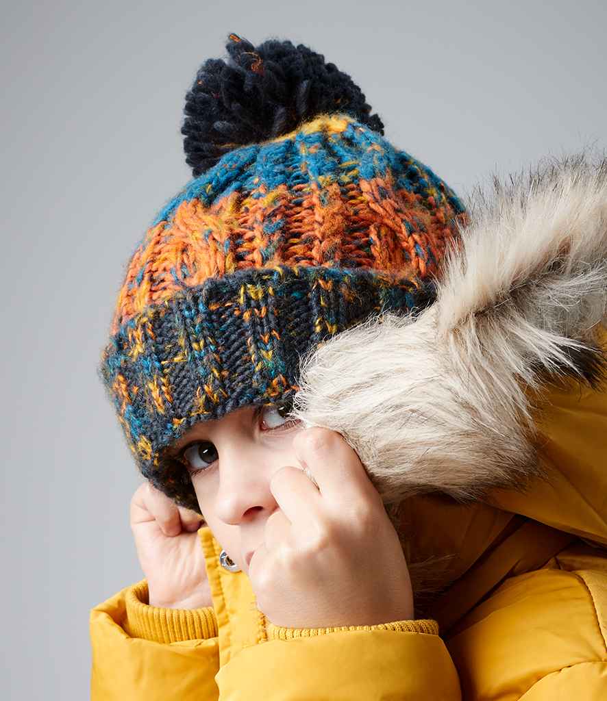 Beechfield Junior Corkscrew Pom Pom Beanie in ONE Retro Blues by Beechfield — Custom branded clothing by Print Press, featuring premium embroidery produced in our specialist print lab in the UK.