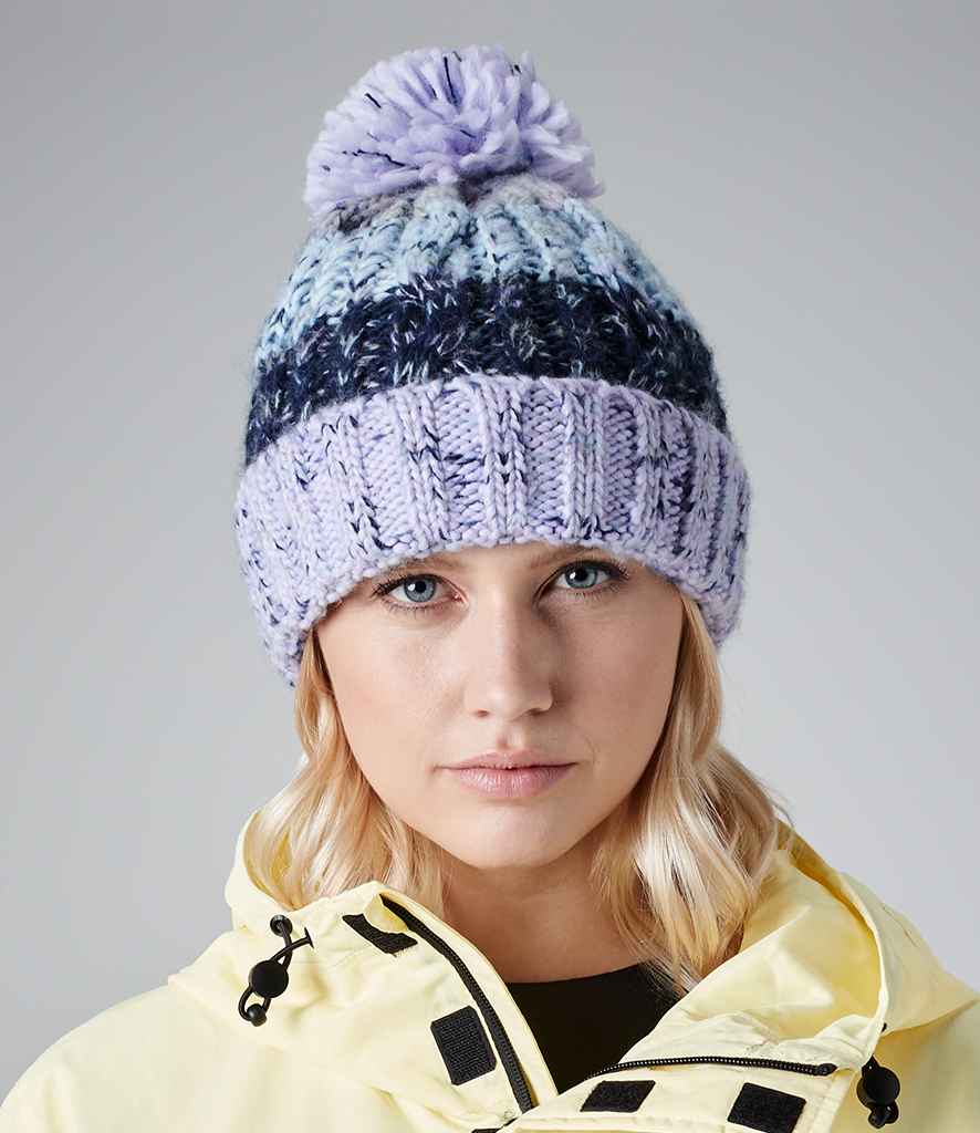 Beechfield Corkscrew Pom Pom Beanie in ONE Lavender Fizz by Beechfield — Custom branded clothing by Print Press, featuring premium embroidery produced in our specialist print lab in the UK.