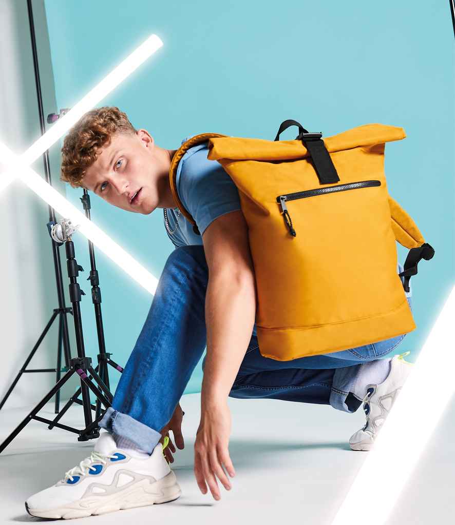 BagBase Recycled Roll-Top Backpack in ONE Mustard by Bagbase — Custom branded clothing by Print Press, featuring premium embroidery produced in our specialist print lab in the UK.