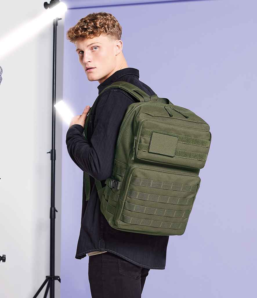BagBase MOLLE Tactical Backpack in ONE Military Green by Bagbase — Custom branded clothing by Print Press, featuring premium embroidery produced in our specialist print lab in the UK.