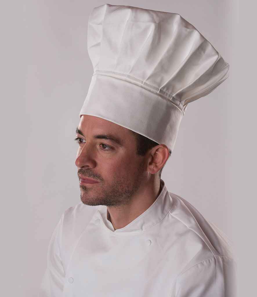 Dennys Tall Chef's Hat in White by Dennys — Custom branded clothing by Print Press, featuring premium embroidery produced in our specialist print lab in the UK.