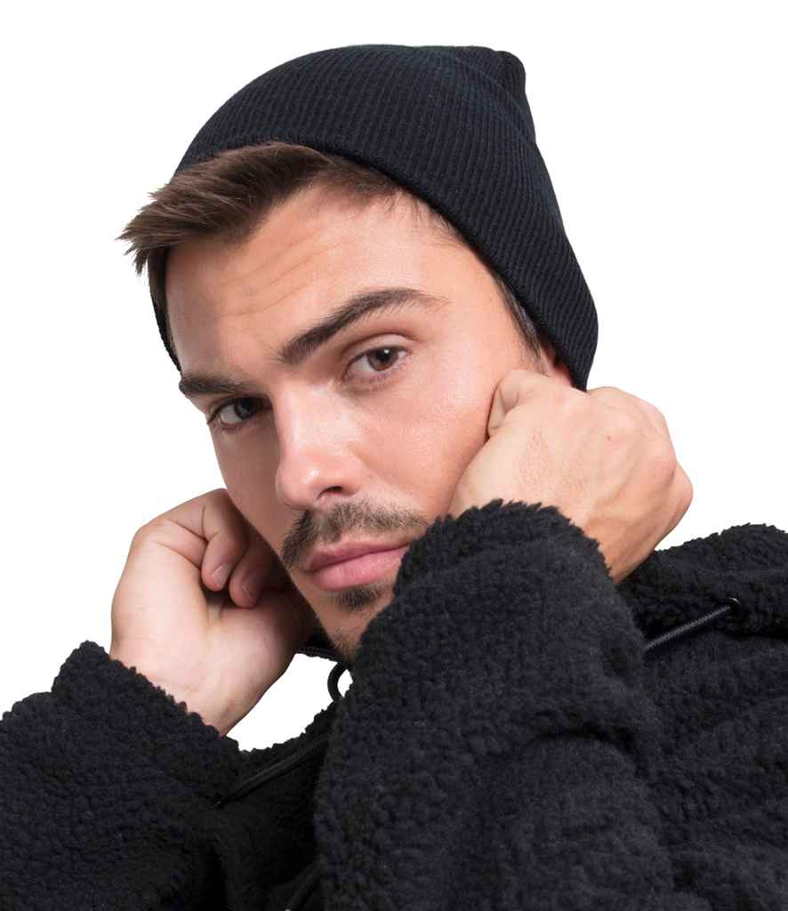 Flexfit Heavyweight Beanie in ONE Black by Flexfit — Custom branded clothing by Print Press, featuring premium embroidery produced in our specialist print lab in the UK.