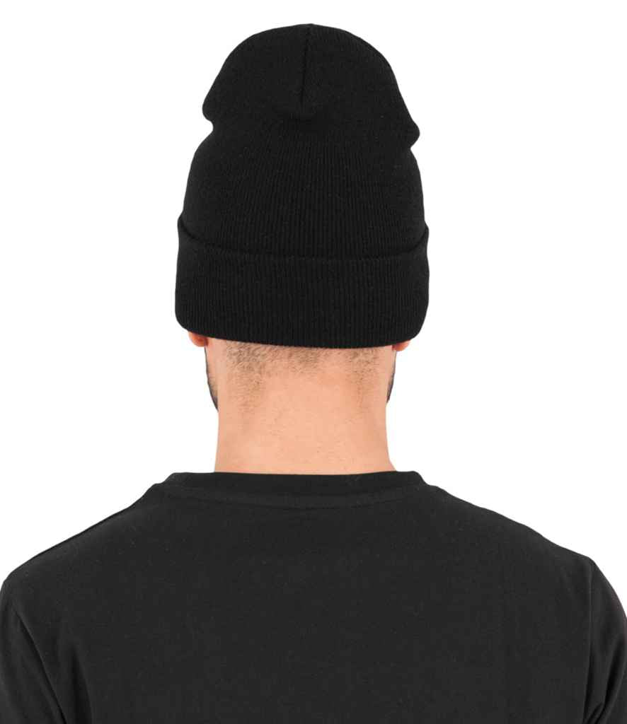 Flexfit Heavyweight Long Beanie in ONE Black by Flexfit — Custom branded clothing by Print Press, featuring premium embroidery produced in our specialist print lab in the UK.