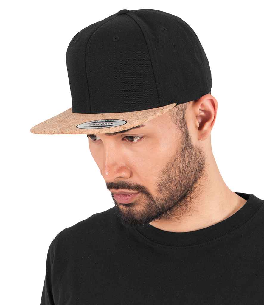 Flexfit Cork Snapback Cap in ONE Black by Flexfit — Custom branded clothing by Print Press, featuring premium embroidery produced in our specialist print lab in the UK.