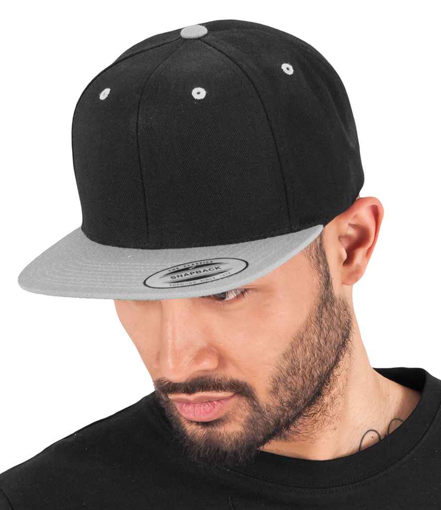 Flexfit Two Tone Classic Snapback Cap in ONE Black Silver by Flexfit — Custom branded clothing by Print Press, featuring premium embroidery produced in our specialist print lab in the UK.