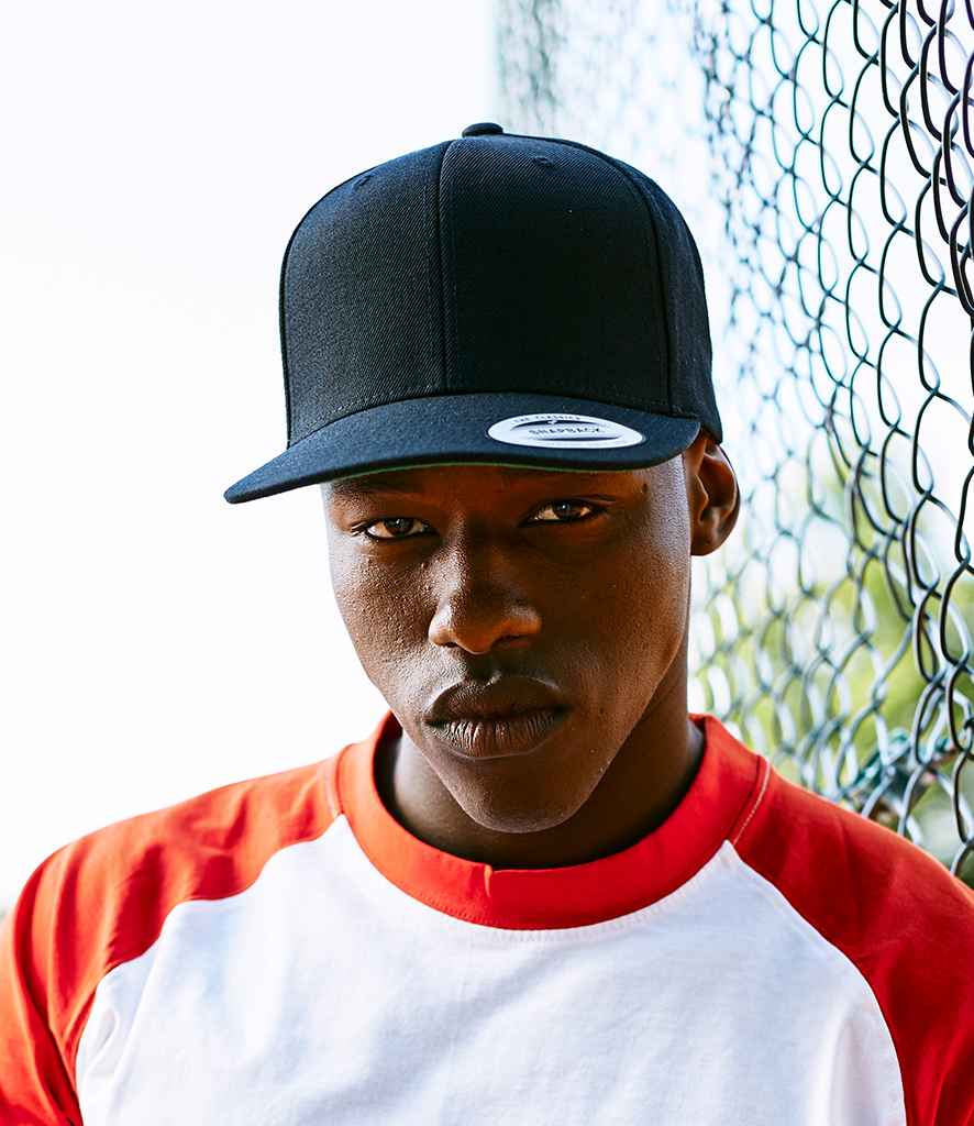 Flexfit Classic Snapback Cap in ONE Black by Flexfit — Custom branded clothing by Print Press, featuring premium embroidery produced in our specialist print lab in the UK.