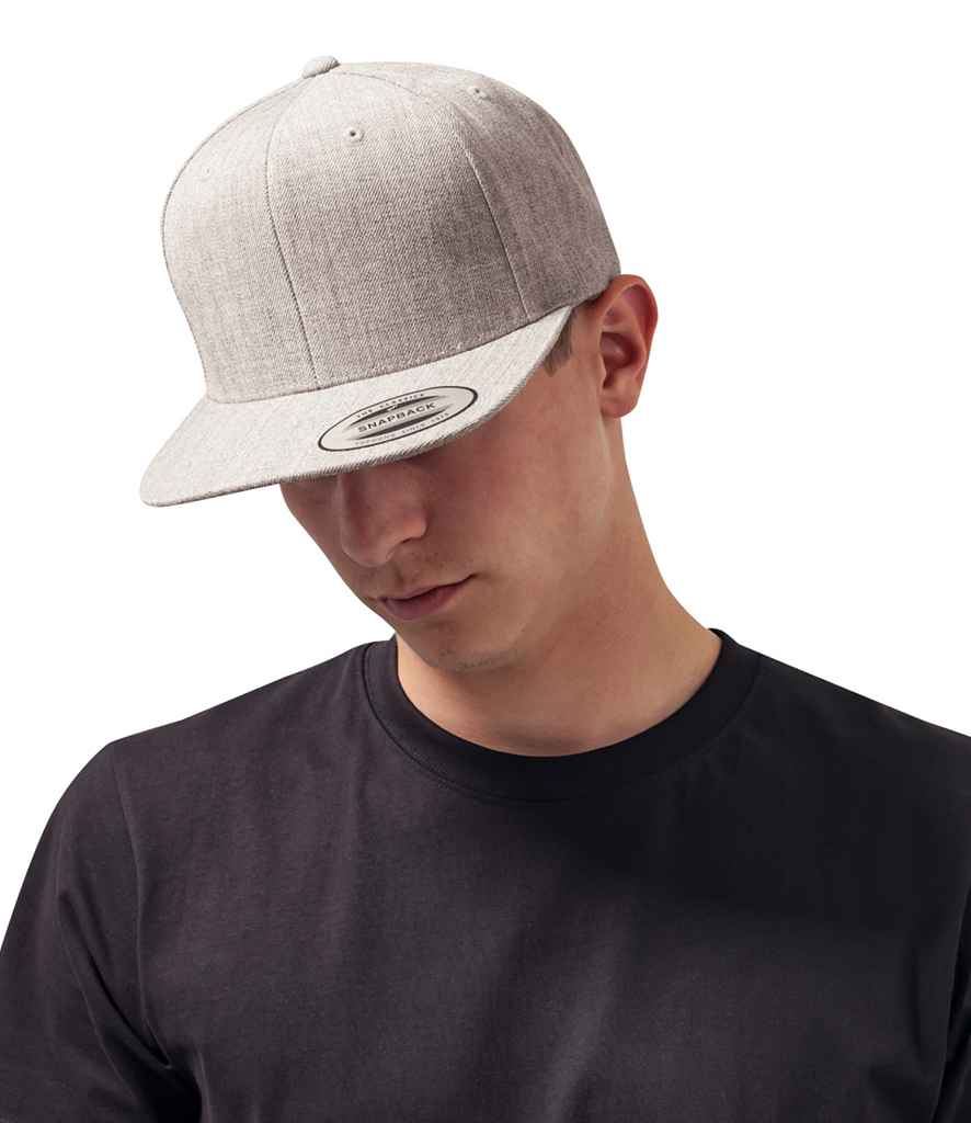Flexfit Classic Snapback Cap in ONE Heather Grey Heather Grey by Flexfit — Custom branded clothing by Print Press, featuring premium embroidery produced in our specialist print lab in the UK.