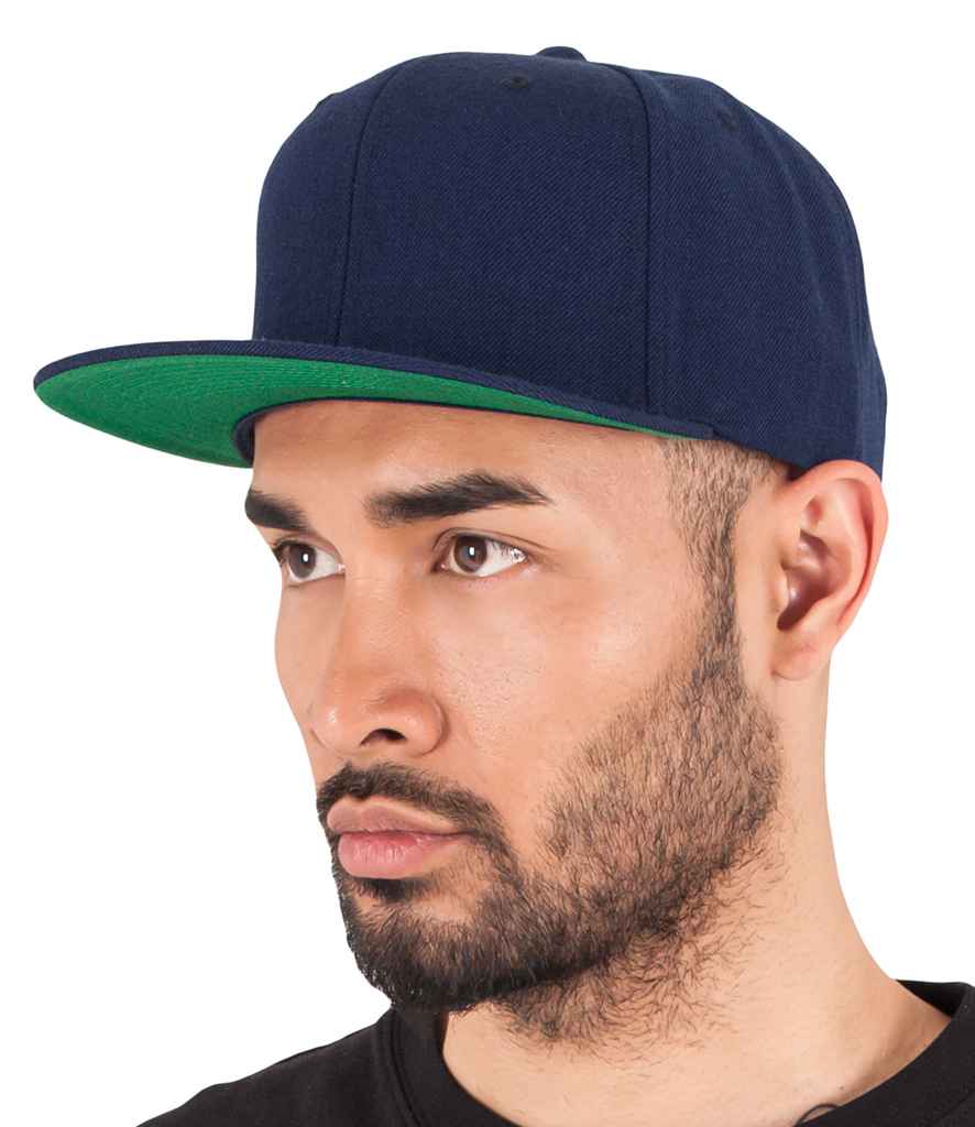 Flexfit Classic Snapback Cap in ONE Navy by Flexfit — Custom branded clothing by Print Press, featuring premium embroidery produced in our specialist print lab in the UK.