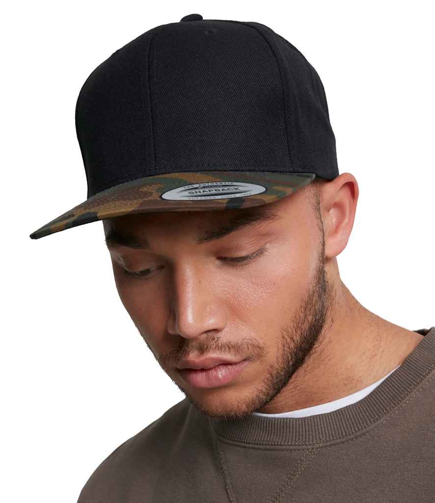 Flexfit Two Tone Classic Camo Snapback Cap in ONE Black Green Camo by Flexfit — Custom branded clothing by Print Press, featuring premium embroidery produced in our specialist print lab in the UK.