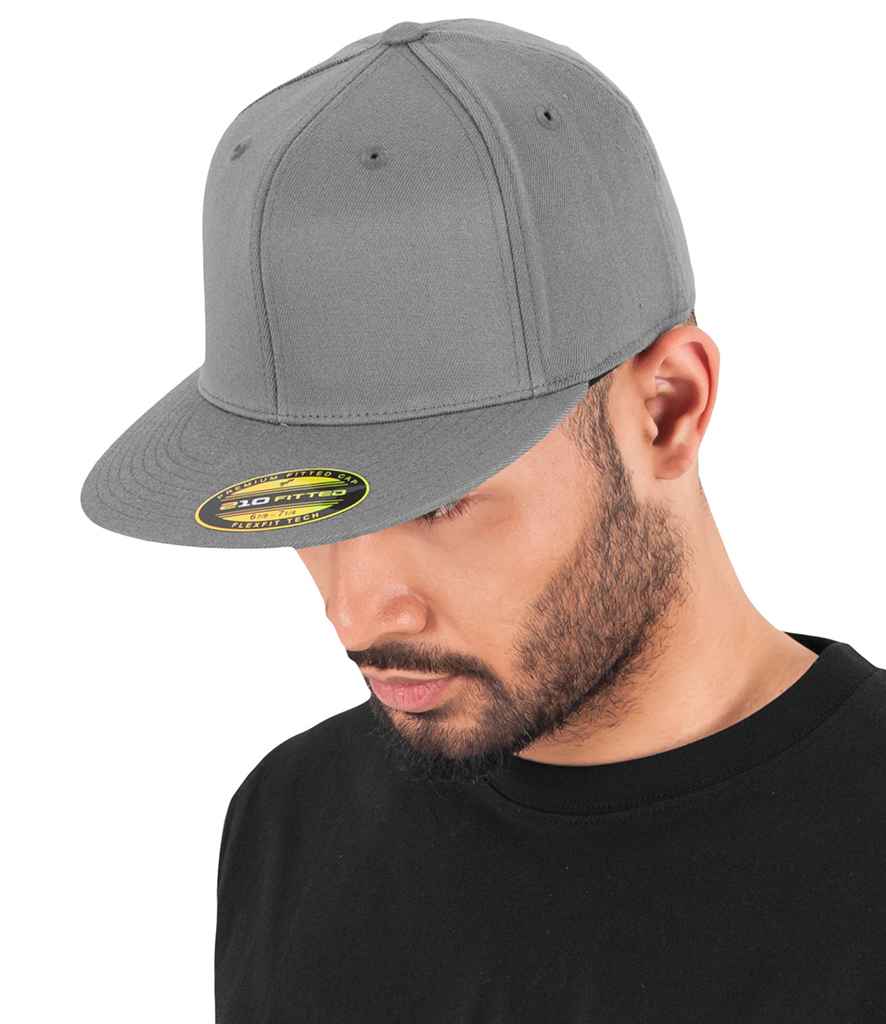 Flexfit Premium 210 Fitted Cap in Black by Flexfit — Custom branded clothing by Print Press, featuring premium embroidery produced in our specialist print lab in the UK.