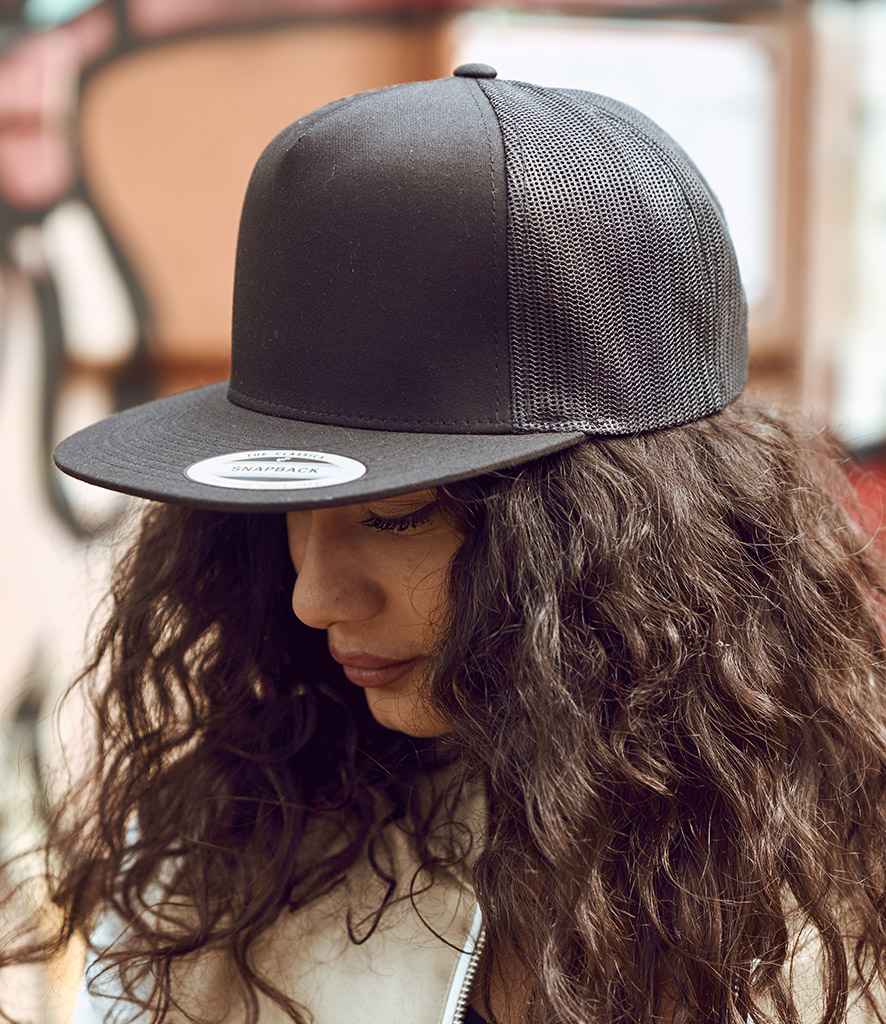 Flexfit 5 Panel Retro Trucker Cap in ONE Black by Flexfit — Custom branded clothing by Print Press, featuring premium embroidery produced in our specialist print lab in the UK.