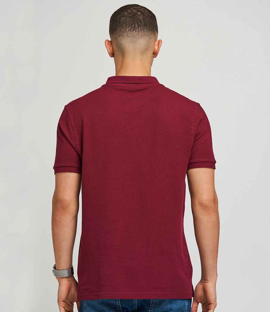 AWDis The 100 Cotton Pique Polo Shirt in by Just Polos — Custom branded clothing by Print Press, featuring premium embroidery produced in our specialist print lab in the UK.