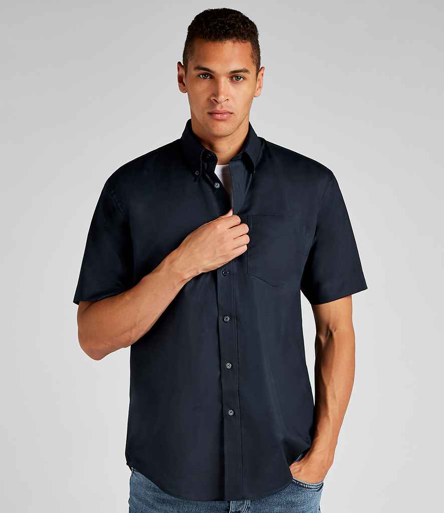 Kustom Kit Short Sleeve Classic Fit Workwear Oxford Shirt in French Navy by Kustom Kit — Custom branded clothing by Print Press, featuring premium embroidery produced in our specialist print lab in the UK.