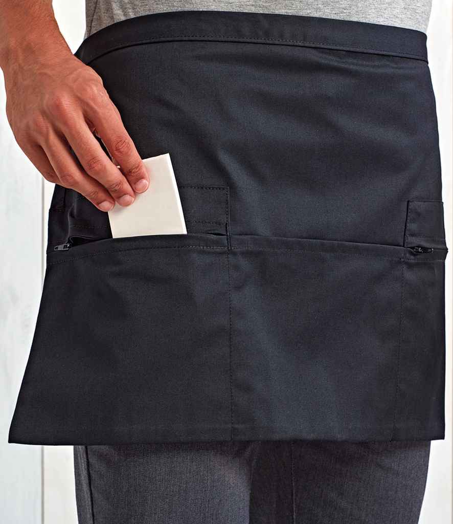 Premier Zip Pocket Waist Apron in ONE Black by Premier — Custom branded clothing by Print Press, featuring premium embroidery produced in our specialist print lab in the UK.