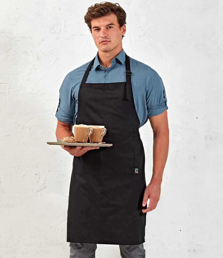 Premier Fairtrade Certified Organic Cotton Bib Apron in ONE Black by Premier — Custom branded clothing by Print Press, featuring premium embroidery produced in our specialist print lab in the UK.