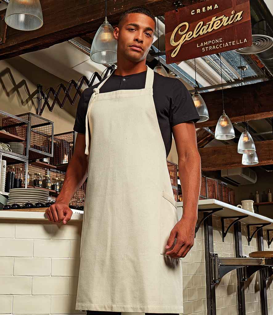 Premier Regenerate Sustainable Bib Apron in ONE Natural by Premier — Custom branded clothing by Print Press, featuring premium embroidery produced in our specialist print lab in the UK.