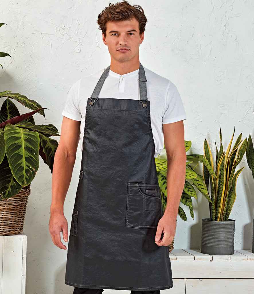 Premier District Bib Apron in ONE Black Denim by Premier — Custom branded clothing by Print Press, featuring premium embroidery produced in our specialist print lab in the UK.