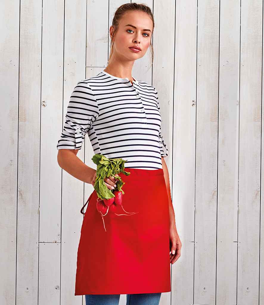 Premier 'Colours' Mid Length Apron in ONE Red by Premier — Custom branded clothing by Print Press, featuring premium embroidery produced in our specialist print lab in the UK.