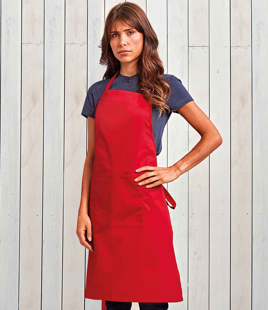 Premier 'Colours' Bib Apron with Pocket in ONE Red by Premier — Custom branded clothing by Print Press, featuring premium embroidery produced in our specialist print lab in the UK.
