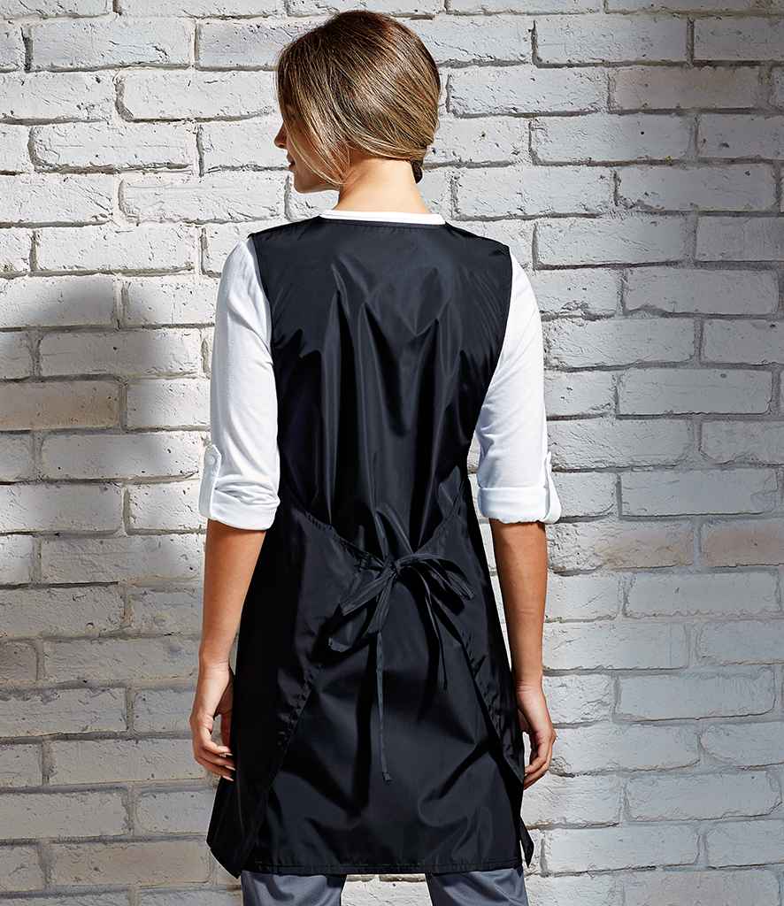 Premier Waterproof Wrap Around Tunic Apron in by Premier — Custom branded clothing by Print Press, featuring premium embroidery produced in our specialist print lab in the UK.