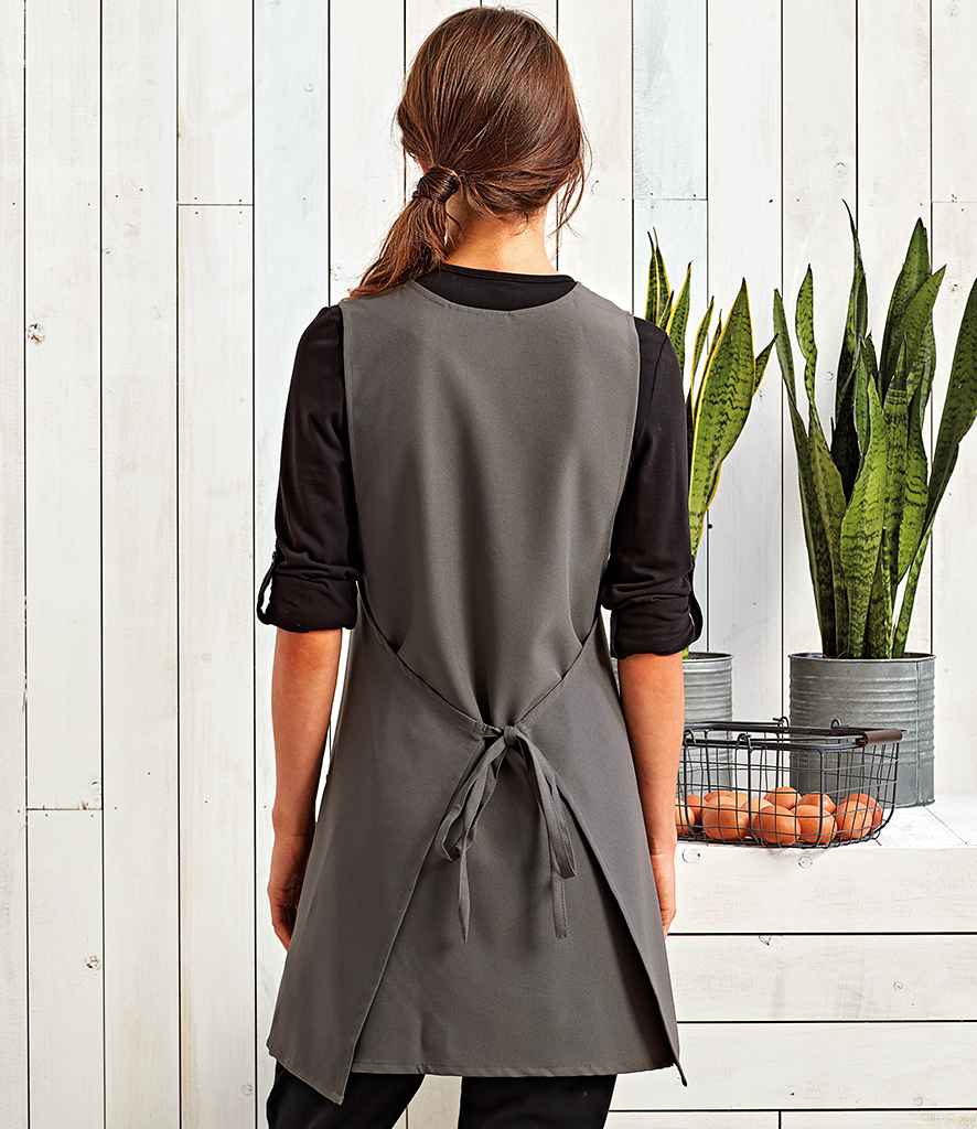 Premier Wrap Around Tunic Apron in by Premier — Custom branded clothing by Print Press, featuring premium embroidery produced in our specialist print lab in the UK.