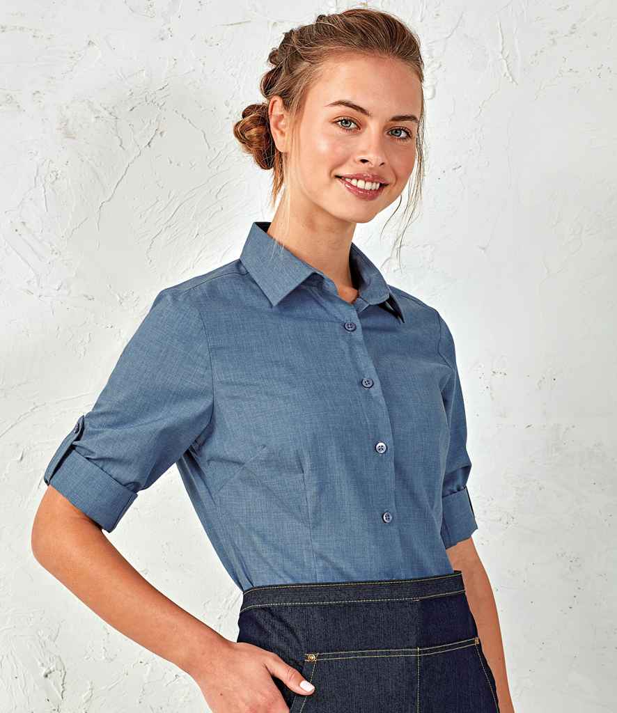 Premier Ladies Cross-Dye Roll Sleeve Shirt in Indigo Denim by Premier — Custom branded clothing by Print Press, featuring premium embroidery produced in our specialist print lab in the UK.