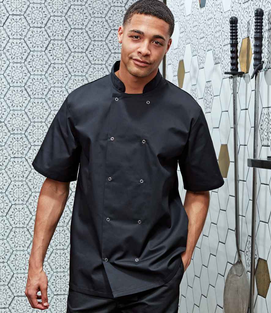 Premier Unisex Short Sleeve Stud Front Chef's Jacket in Black by Premier — Custom branded clothing by Print Press, featuring premium embroidery produced in our specialist print lab in the UK.